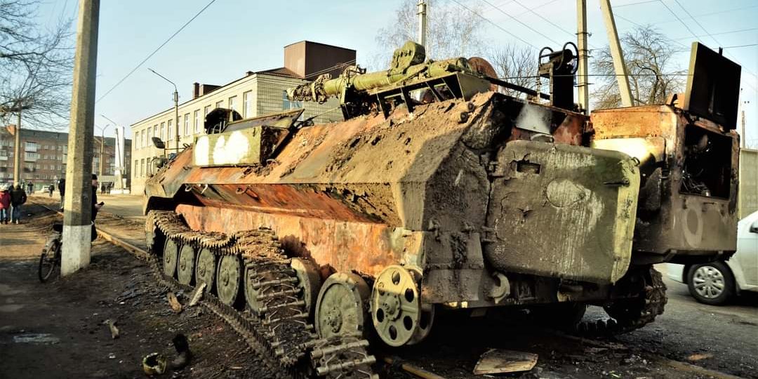 A photo of a destroyed armoured personnel carrier in Ukraine, February 2022.