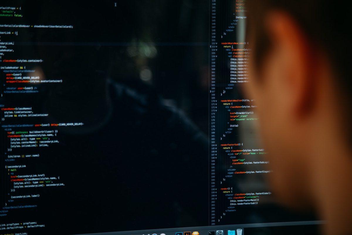 Photo of a person looking at a computer screen.