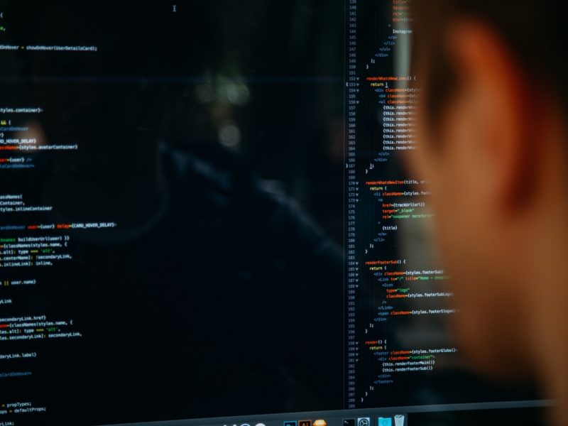 Photo of a person looking at a computer screen.