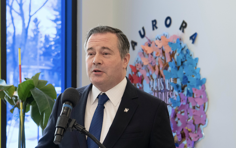 Alberta Premier Jason Kenney, his lapel pin drooping toward the distress position, a week before his secret speech to UCP political staffers.