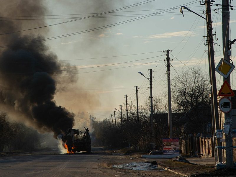 Photo shows a bus burning as Russia invades Ukraine on Feb. 24, 2022, on a road from Kharkiv to Kyiv.