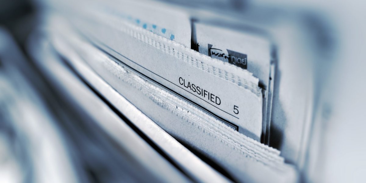 Black and white photo of newspapers in a filing cabinet