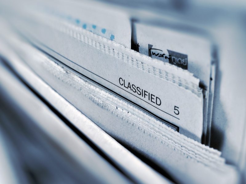 Black and white photo of newspapers in a filing cabinet