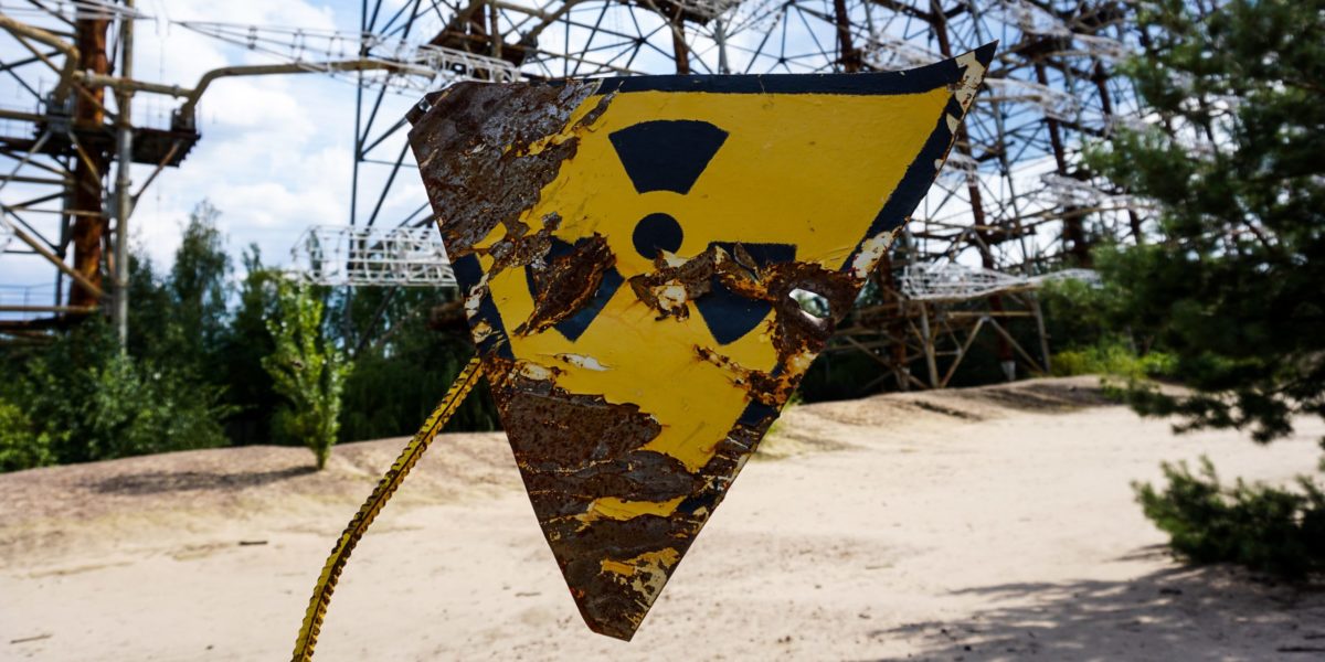 Photo of a sign with a radioactive symbol