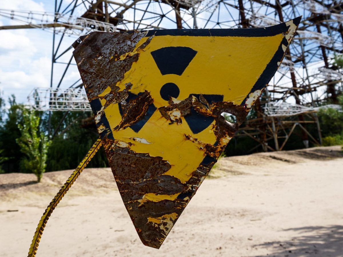 Photo of a sign with a radioactive symbol