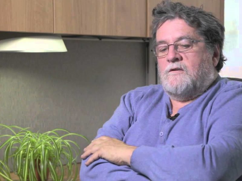 Photo of Pierre Beaudet sitting at a desk setting being interview.