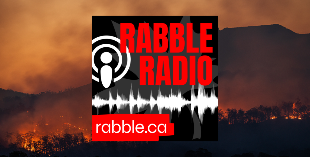 Promotional photo for rabble radio against a backdrop of a forest on fire