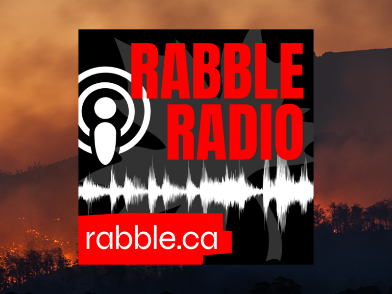 Promotional photo for rabble radio against a backdrop of a forest on fire