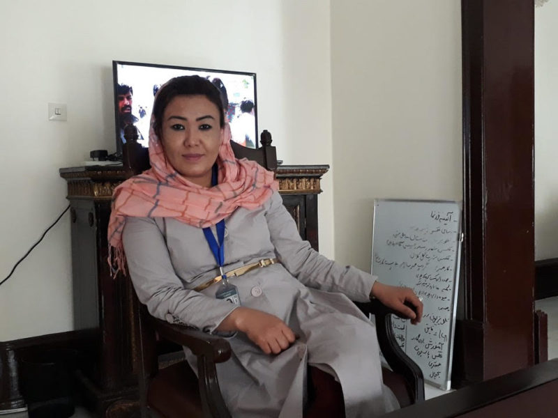 Photo of Farzana Adell sitting in a chair