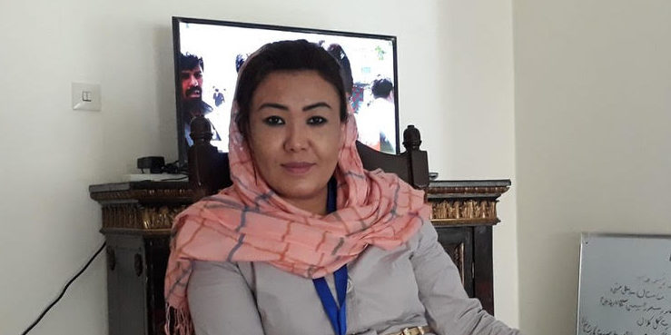 Photo of Farzana Adell sitting in a chair