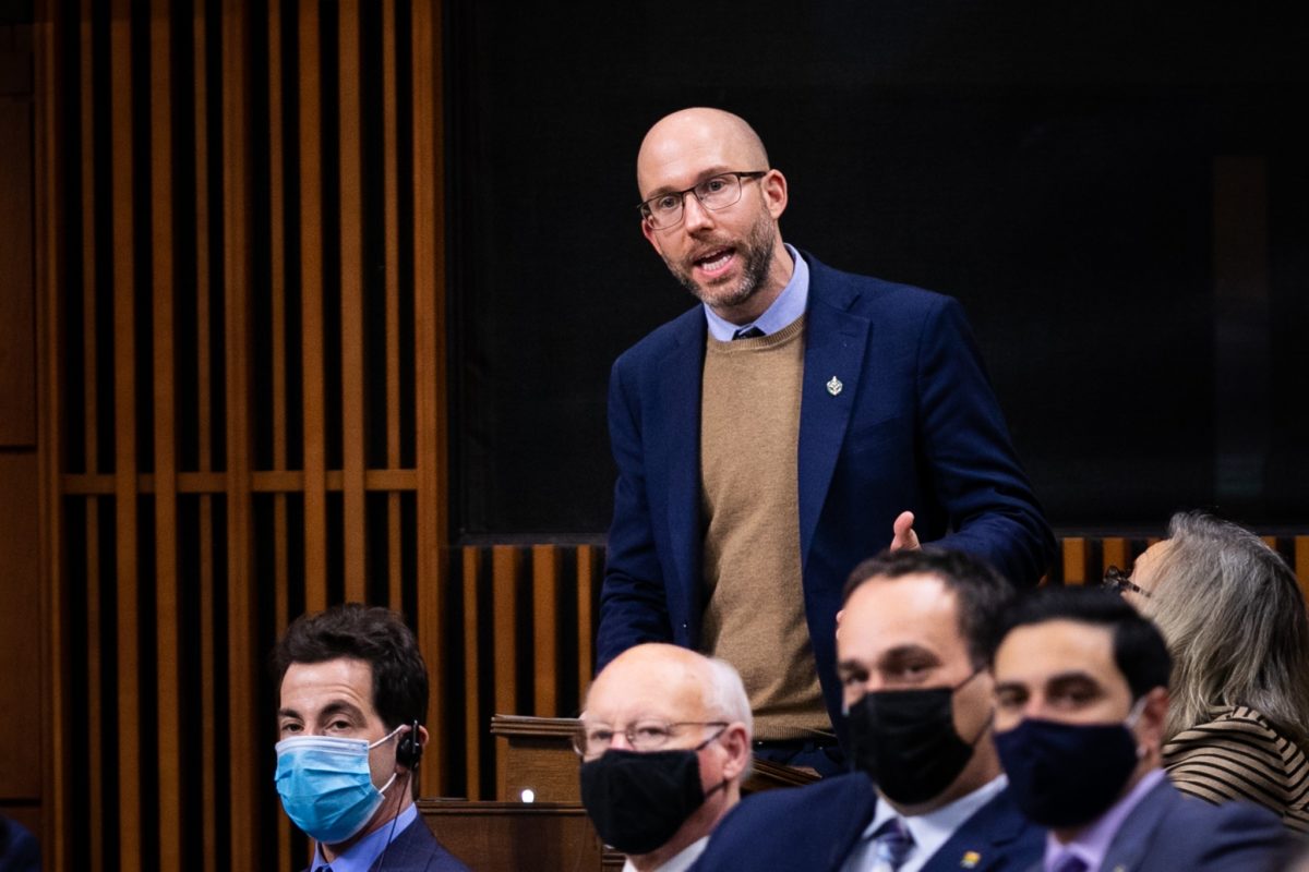 A photo of Kitchener Centre MP Mike Morrice who submitted the petition to fast-track the Canadian Disability Benefit, speaking on the floor of the House of Commons.