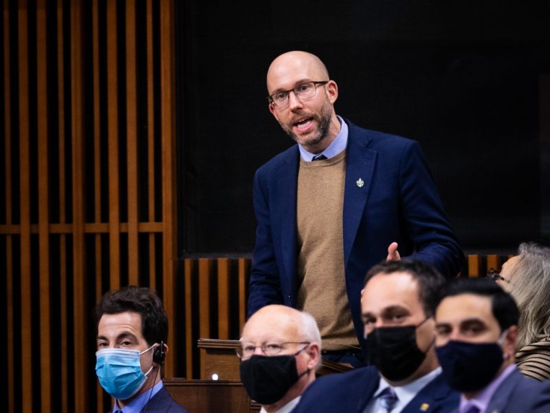 A photo of Kitchener Centre MP Mike Morrice who submitted the petition to fast-track the Canadian Disability Benefit, speaking on the floor of the House of Commons.