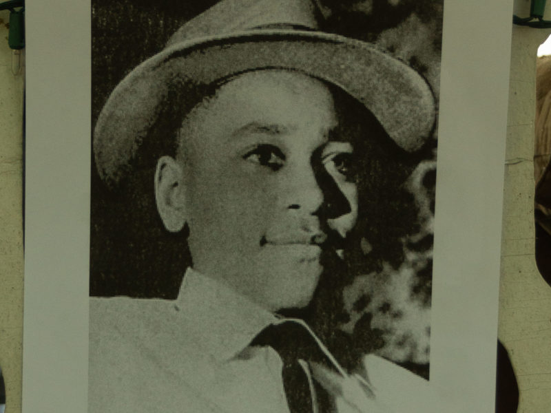 A poster of a photo of Emmett Till.