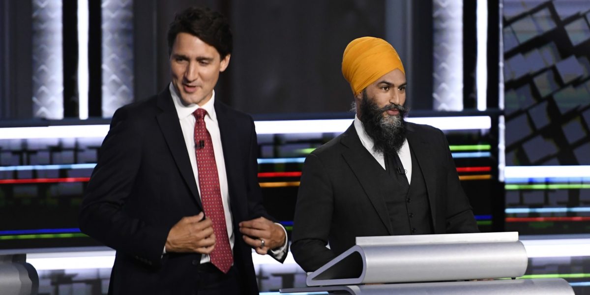 A photo of Justin Trudeau and Jagmeet Singh at the federal election debate 2021