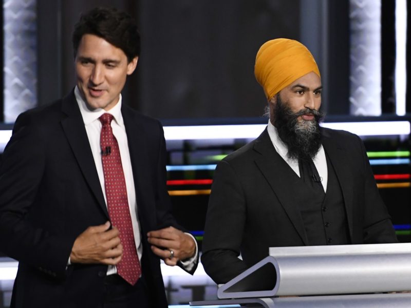 A photo of Justin Trudeau and Jagmeet Singh at the federal election debate 2021