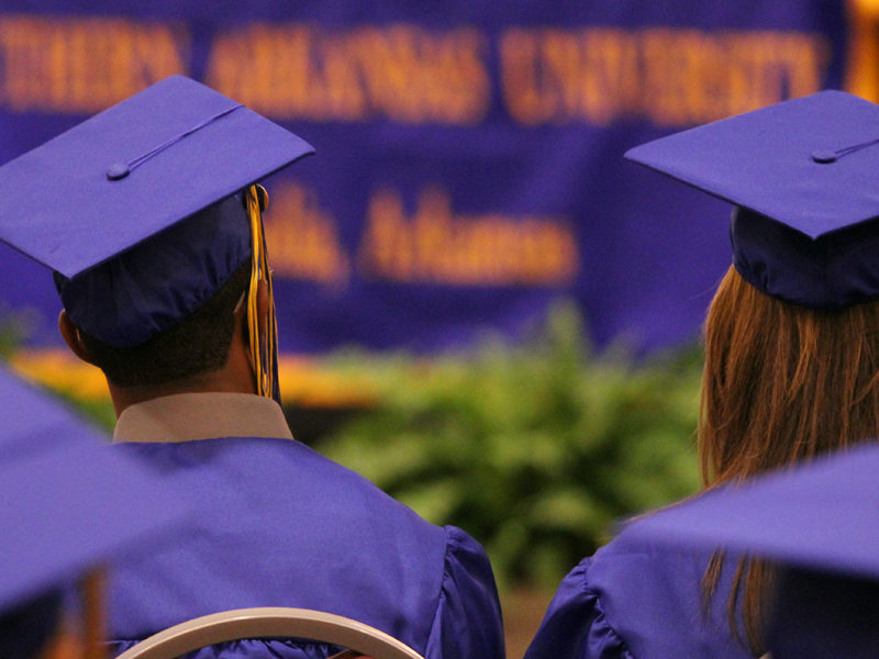 A photo of undergrads preparing to graduate.