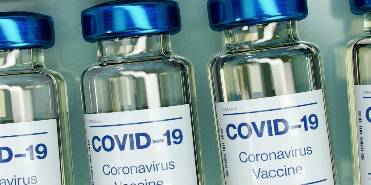 A photo of a blue and white covid-19 vaccine bottle mockup.