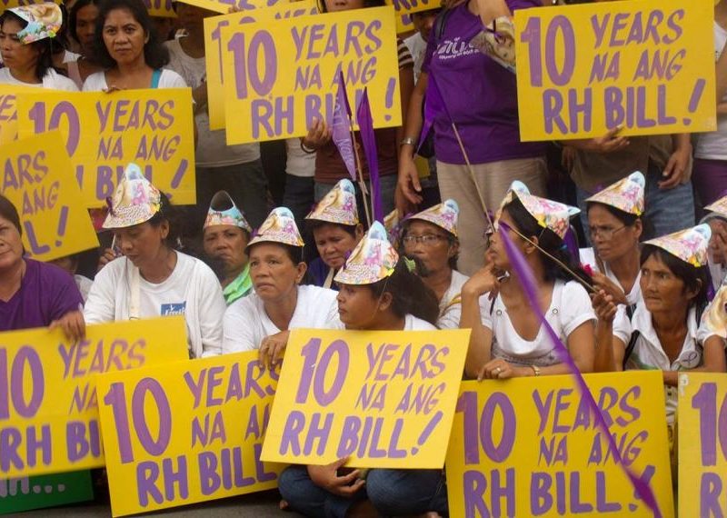 Protesters in front of the Philippines Congress demand a reproductive health law in 2011. Activists spent more than 10 years demanding the government pass it.Credit: Likhaan