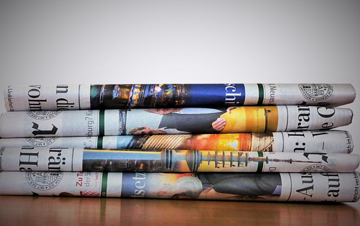 An image of newspapers piled up.