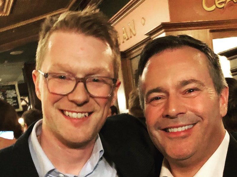 A photo of Brock Harrison with his boss, Alberta Premier Jason Kenney.