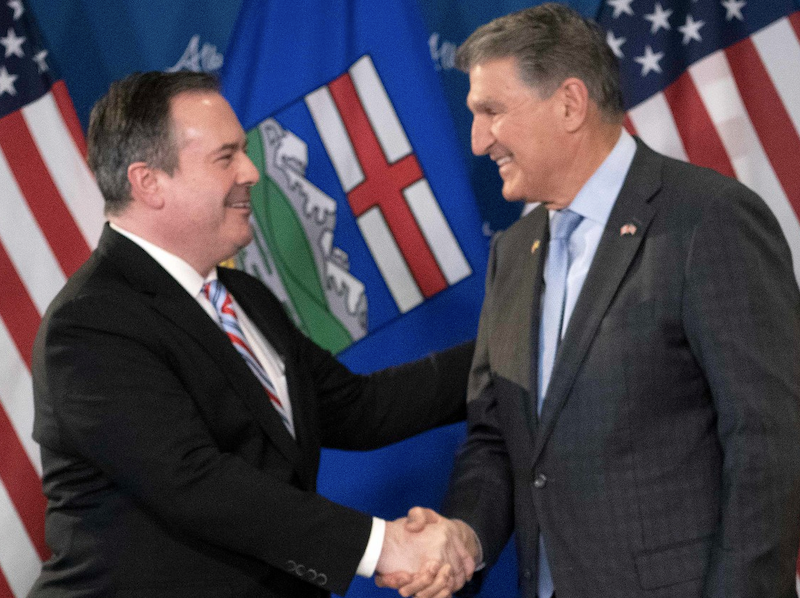 A photo of Alberta Premier Jason Kenney and his new BFF, West Virginia Senator Joe Manchin.