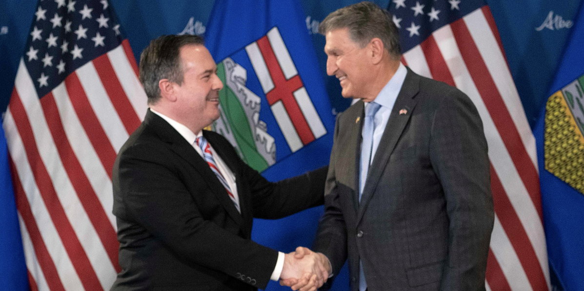 A photo of Alberta Premier Jason Kenney and his new BFF, West Virginia Senator Joe Manchin.