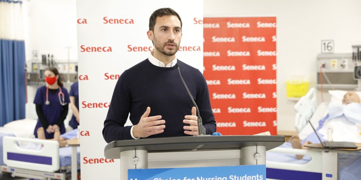 A photo of Ontario Education Minister Stephen Lecce making an announcement at Seneca College in 2021.