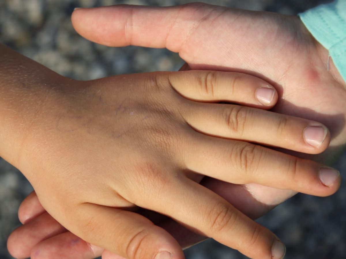 A stock image of holding hands.