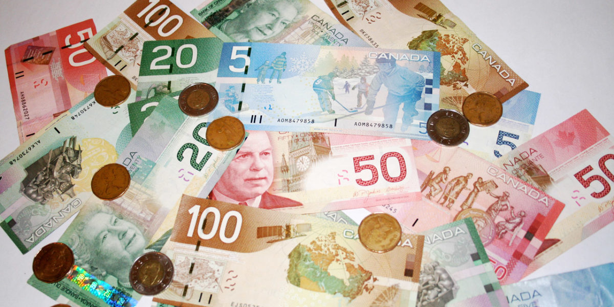 A photo of Canadian currency. CERB is requiring millions of Canadians to pay back money they were promised was not a loan.