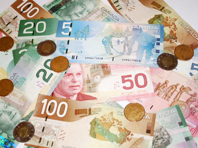 A photo of Canadian currency. CERB is requiring millions of Canadians to pay back money they were promised was not a loan.