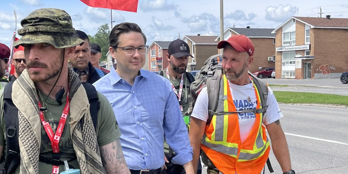 Photo of Pierre Poilievre and James Topp marching in Ottawa