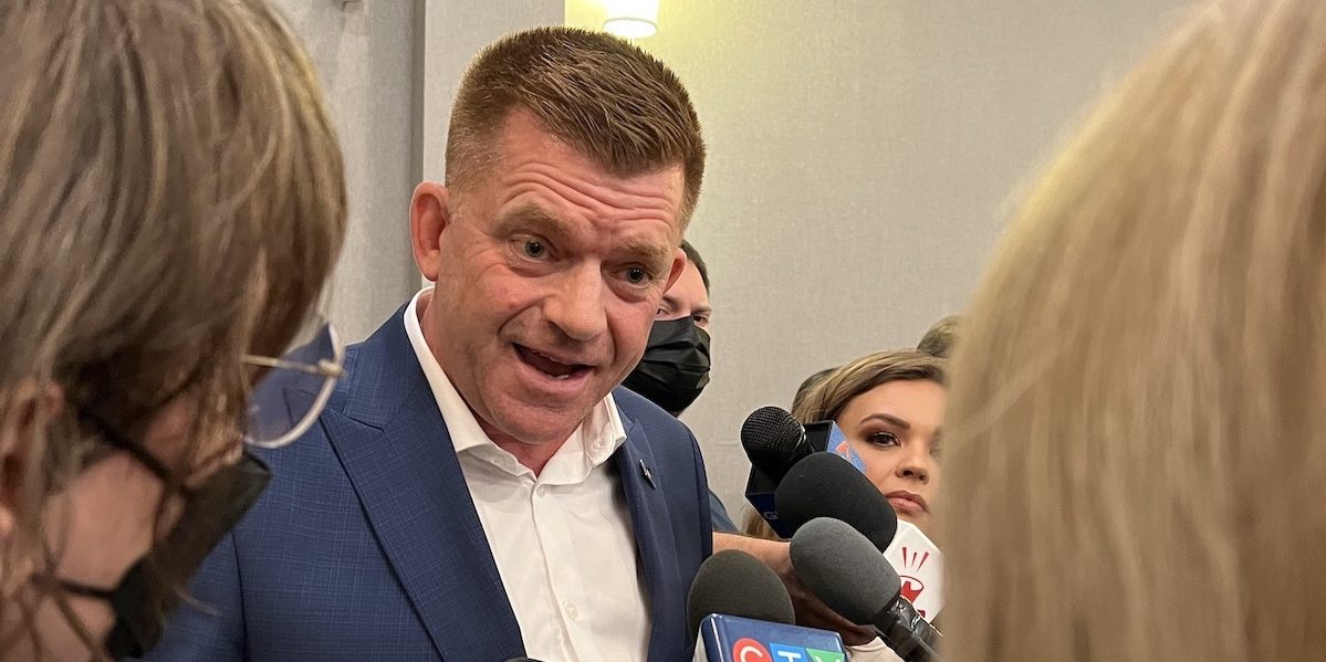 A photo of UCP leadership candidate Brian Jean addresses the media at his campaign launch last night.