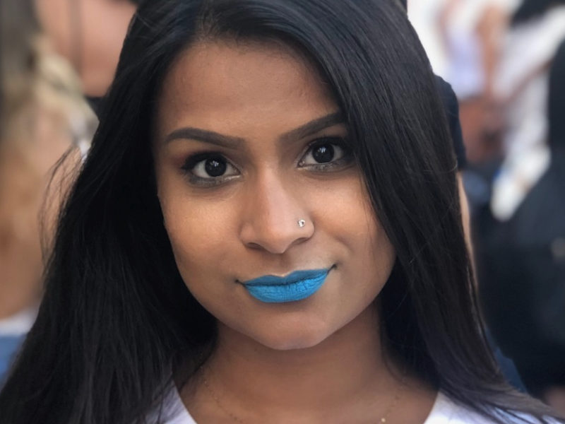 Photo of Alyy Patel with blue lipstick