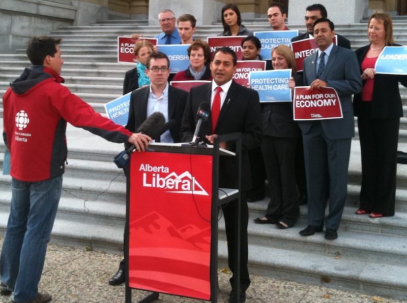 A photo of then the Alberta Liberal leader, Raj Sherman gets a little media attention on the steps of the Alberta Legislature in 2011.