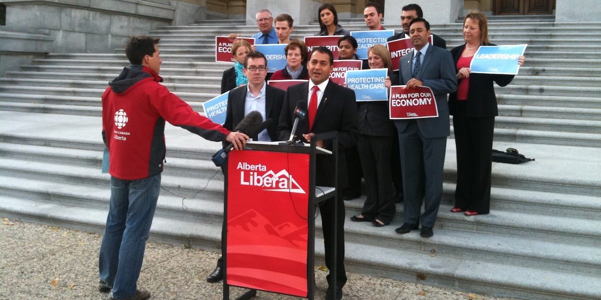 A photo of then the Alberta Liberal leader, Raj Sherman gets a little media attention on the steps of the Alberta Legislature in 2011.