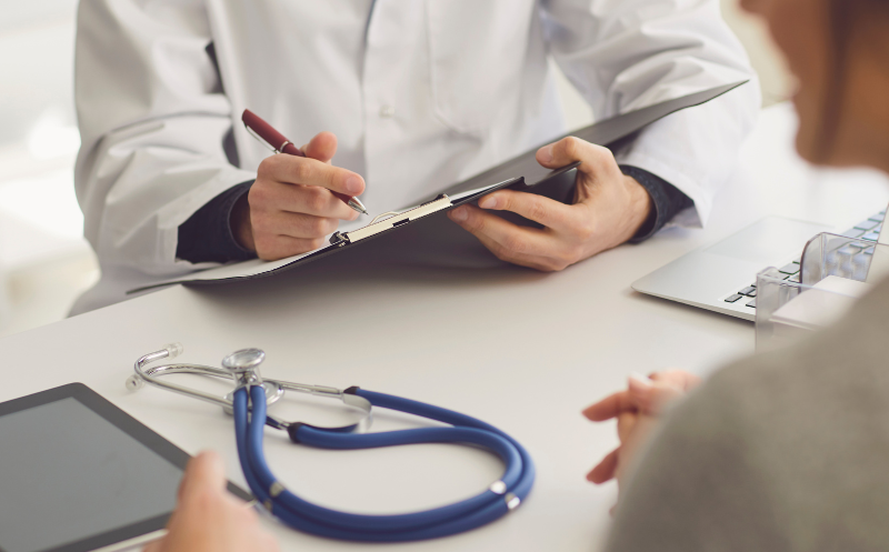 A stock image of a medical professional giving a consultation.