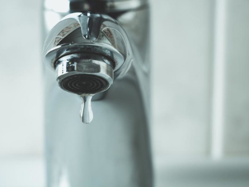 Photo of a tap dripping clean water