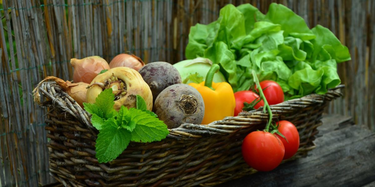 A photo of a basket of vegetables.