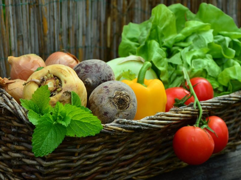 A photo of a basket of vegetables.