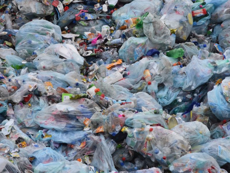 A photo of thousands of plastics in the waste dump.