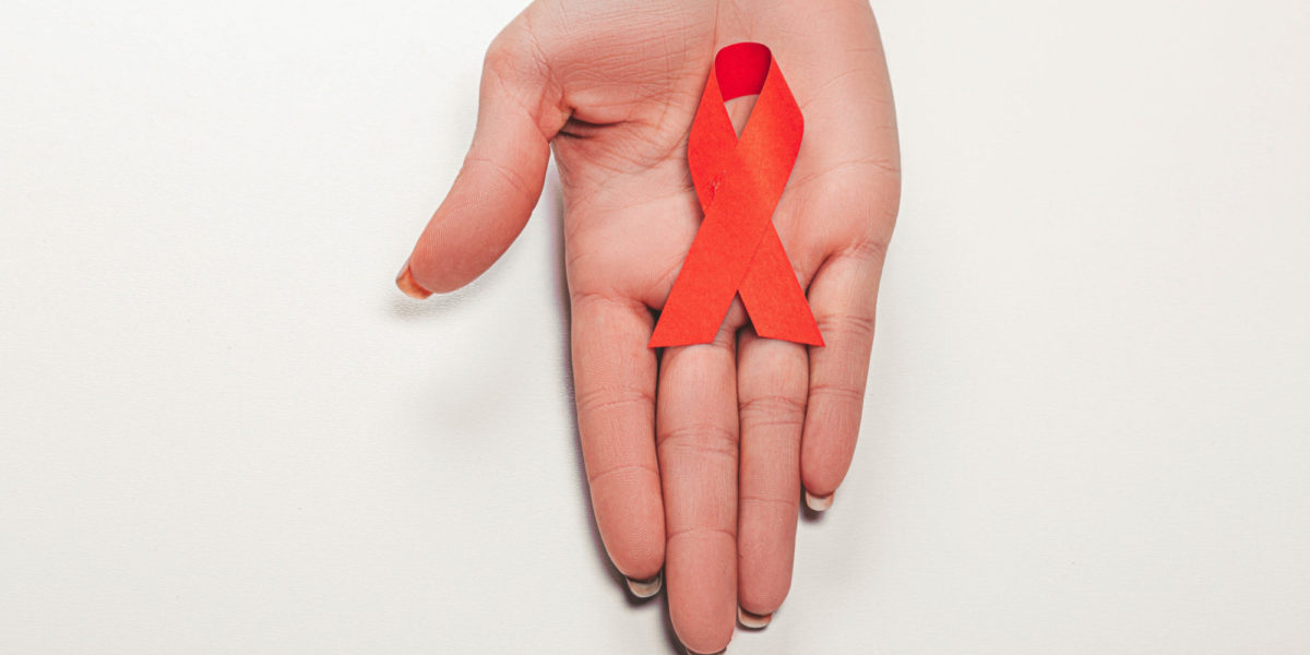 A photo of A red ribbon symbolizes World AIDS/HIV Day, which falls on December 1, in 2022.