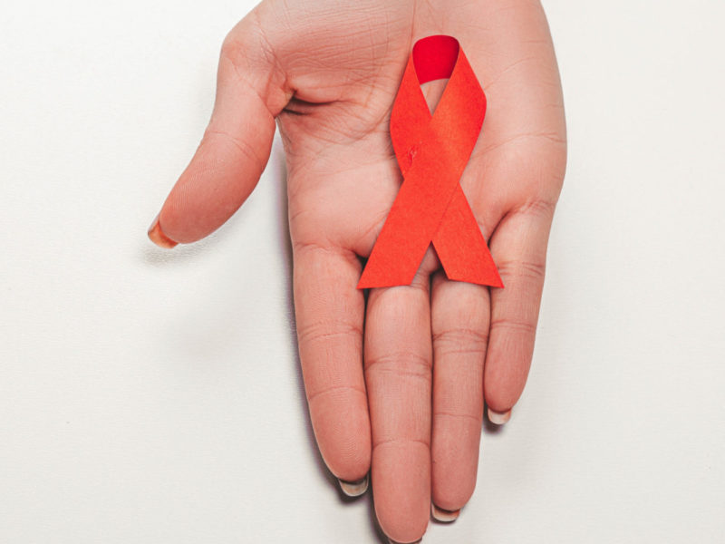 A photo of A red ribbon symbolizes World AIDS/HIV Day, which falls on December 1, in 2022.