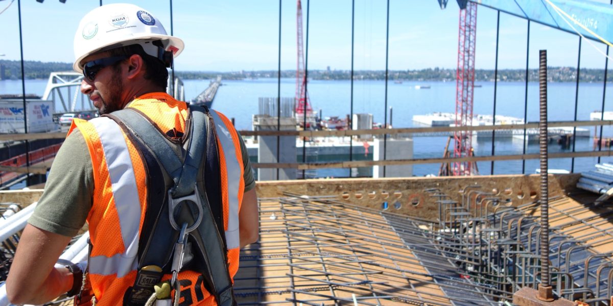 A photo of a construction worker in the summer heat.