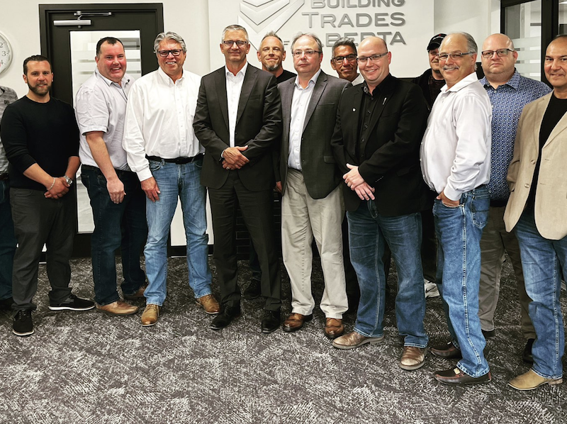 UCP leadership candidate Travis Toews, sixth from left, MLA Searle Turton, centre in black shirt and jacket, and Building Trades of Alberta leaders yesterday.