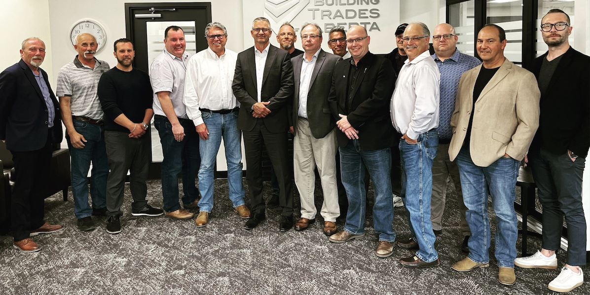 UCP leadership candidate Travis Toews, sixth from left, MLA Searle Turton, centre in black shirt and jacket, and Building Trades of Alberta leaders yesterday.