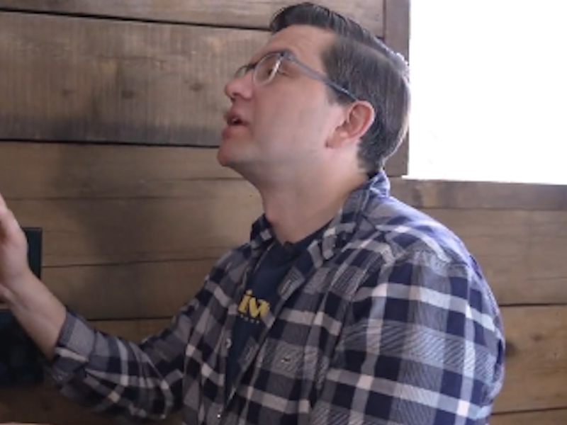 A photo of Federal Conservative leadership candidate Pierre Poilievre as he strokes his wood in a screenshot of his latest campaign video.