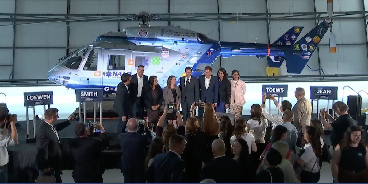 A photo of the UCP leadership candidates gathered ’round a helicopter in Medicine Hat last night – the print on the image indicates the transmission problems that plagued the party’s livestream throughout the debate.