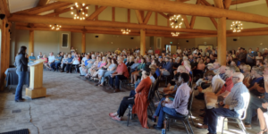 Danielle Smith addresses her rally in Airdrie Monday night.