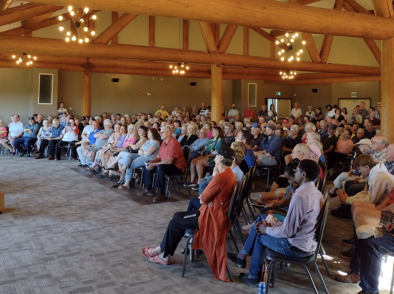 Danielle Smith addresses her rally in Airdrie Monday night.