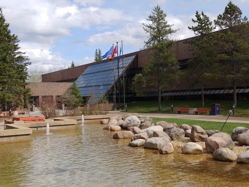 A photo of the entrance to Athabasca University’s now mostly empty administration building just west of the Town of Athabasca